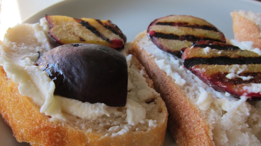 Grilled plum on bread with ricotta cheese by Tiny Chili Pepper